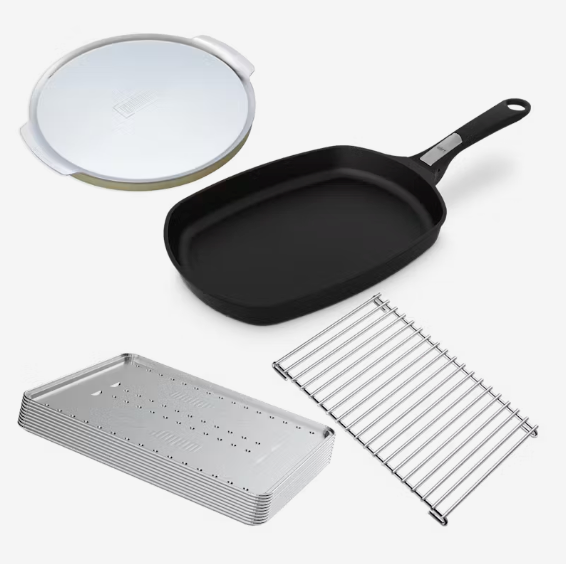 A set of Weber Baby Q Starter Pack which includes a black frying pan, a stainless steel trivet, aluminum convection trays, and a pizza stone with a tray.