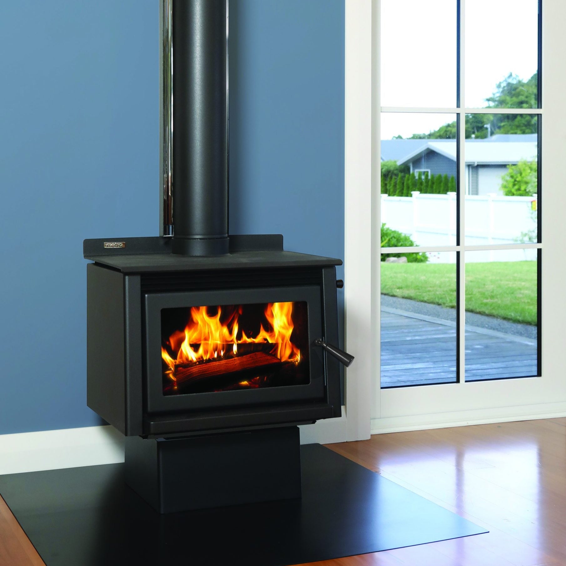 Metro Wee Rad Base wood fire with sleek pedestal design – Clean Air Approved log burner for modern NZ homes