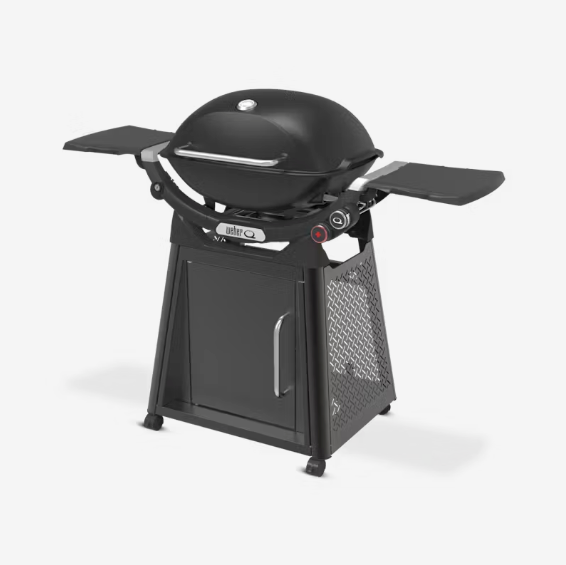 Weber Q3200N BBQ gas grill with lid open and cast iron cooking grates"