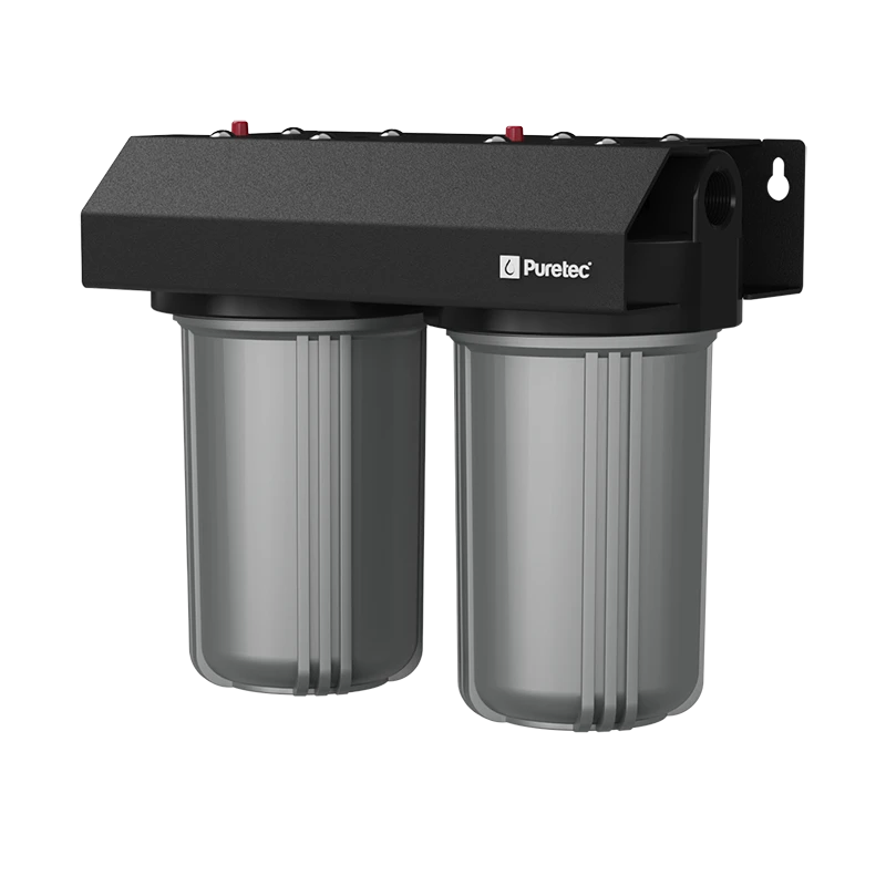 A Puretec whole house dual water filtration system with two cylindrical filter housings and a black top housing unit.