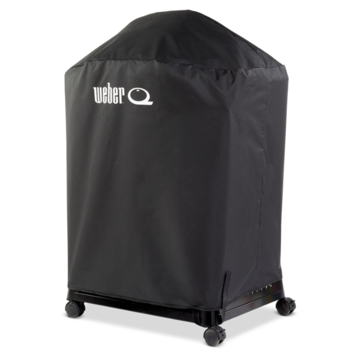 A black Weber Family Q barbecue cart cover with velcro straps and the white Weber Q logo on the front.