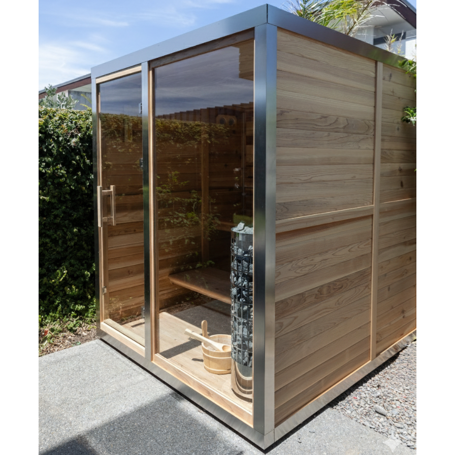 Wooden outdoor sauna with glass doors in a garden setting