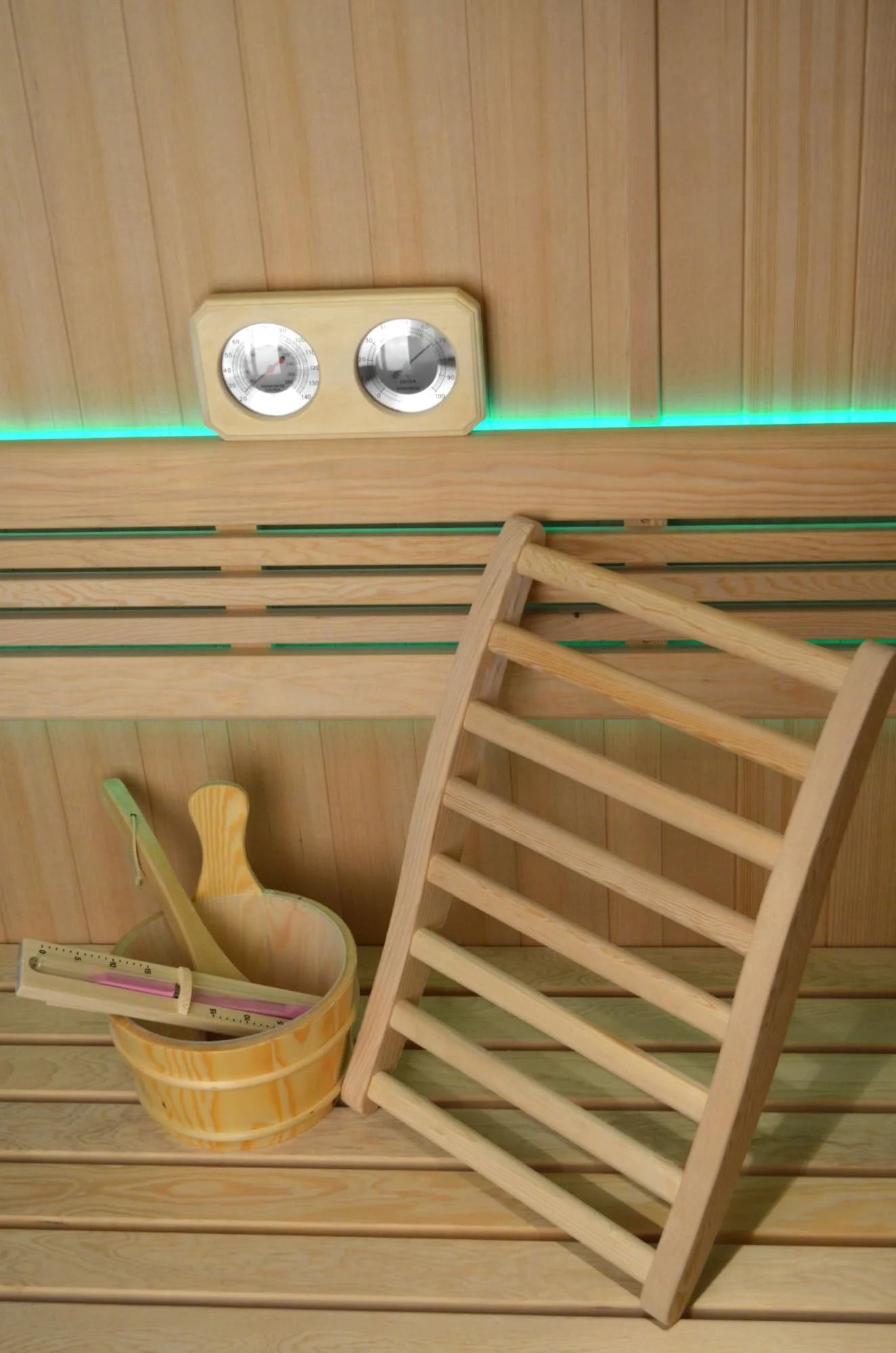 Interior of Sereno Indoor Sauna showing ergonomic backrests, LED chromotherapy lighting, and Bluetooth audio system