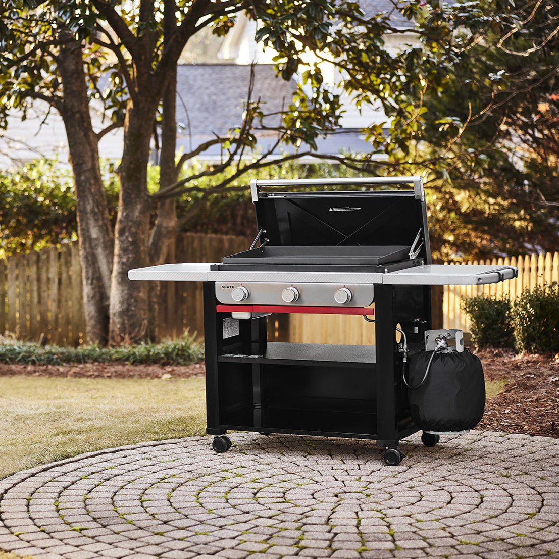 Weber Slate 30-inch Griddle BBQ with 3 burners, rust-resistant cooktop, even heat distribution, and Weber Works™ storage system – perfect for outdoor cooking.